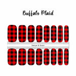 Traditional red and black buffalo plaid nail wrap nail design. 