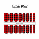 Traditional red and black buffalo plaid nail wrap nail design.