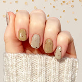 Two different shades of nude with tiny rose gold foil hearts nail wrap nail design.