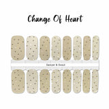 Two different shades of nude with tiny rose gold foil hearts nail wrap nail design.