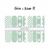 Green and white combination of checkerboard, smiley faces, flowers and yin yang curves nail wrap nail designs