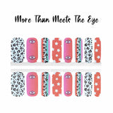 combo of of pink, orange and blue with leopard print and stars with one single eye nail wrap nail design