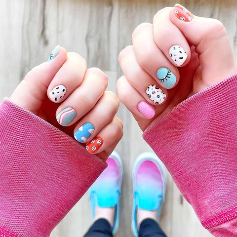 A mix of fun smiley faces, leopard print, spots, curves and eyelashes on orange, , mint, white, blue, pink backgrounds nail wrap nail design