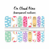 A mix of fun smiley faces, stars, hearts, clouds, rainbow and daisies on blue, green, purple, yellow and pink backgrounds nail wrap nail design