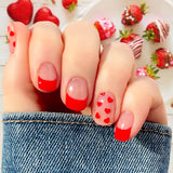 Red hearts on clear with red French tips nail wrap nail design.
