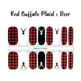 Full red buffalo plaid with red buffalo plaid deer head silhouette on white accents and one white deer head silhouette on black accent nail wrap nail design.