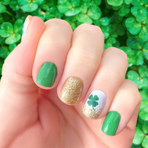 St. Patrick's Day gold glitter, green accents and four leaf clovers