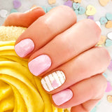 Combination of solid pink nail wraps and gold glitter stripes on white with little pink hearts accents nail wrap nail design.