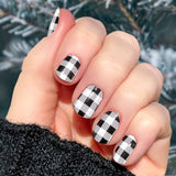 White and black buffalo check nail wrap nail design.