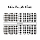 White and black buffalo check nail wrap nail design.