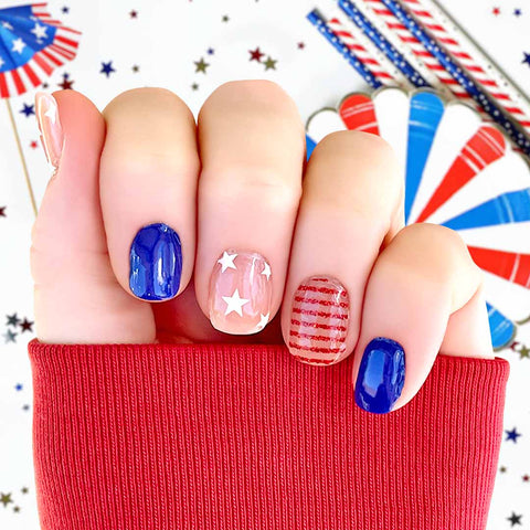 Blue solid, white stars on clear and red glitter stripes on clear nail wrap nail design