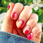 Magenta curves and a white five petal flower on each nail over a transparent background nail wrap nail design. 