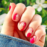 Magenta curves and a white five petal flower on each nail over a transparent background nail wrap nail design. 