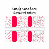 Mini candy canes on solid white with solid red accents nail wrap nail design. 