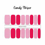 Combination of dark pink solids and dark pink thin stripes on white nail wrap nail design. 