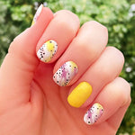 Combo of white with yellow and magenta splashes of color with spots and and solid yellow nail wrap nail design
