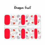 Combination of dragon fruit art on white and solid red accents nail wrap nail design