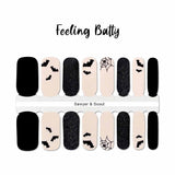 Black Halloween bats and spider webs on a light pink background with solid black accents nail wraps