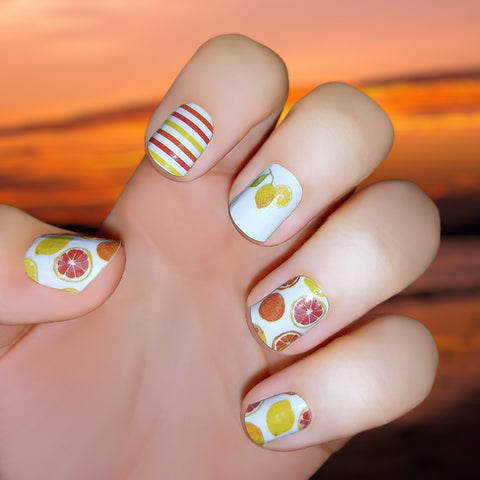 Citrus theme with orange and lemon clipart, with orange and yellow stripes on white accents nail wrap nail design