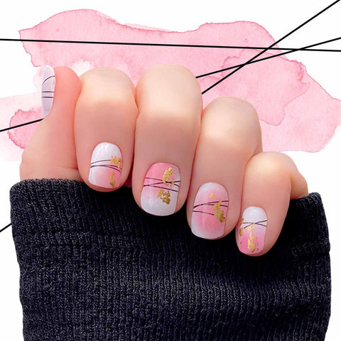 Pink and white combo with think black criss-cross lines and gold foil splotches nail wrap nail design