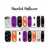a combination of ghosts, spiders, pumpkin face, zombie eyes on orange, purple, black and white background nail wraps