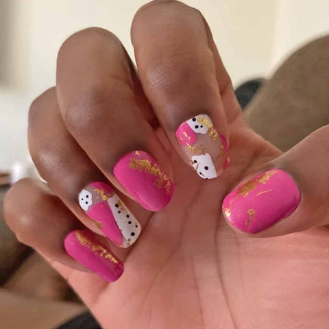 Mix of pink with gold foil and white with black spots with some transparent sections nail wrap nail designs
