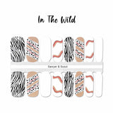 Mix of zebra themed with black spots and curves on nude with white accents nail wrap nail designs