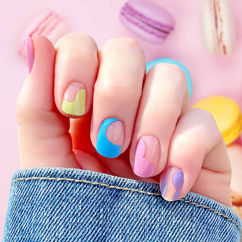Solid pastel colored curves of pink, purple, blue, green and nude on clear nail wrap nail designs