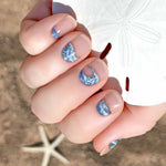 Blue ocean waves on transparent nail wrap nail designs