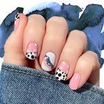 Pink with white stars, curves, cow print and solid blue accent nail wrap nail design