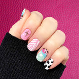Combination of black cow print on white and pink, pink zebra and leopard prints with white stars on blue accents nail wrap nail design
