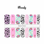 Combination of black cow print on white and pink, pink zebra and leopard prints with white stars on blue accents nail wrap nail design