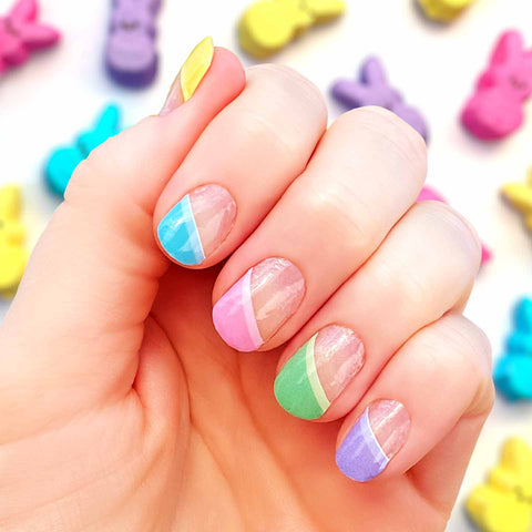 Mix of slanted pastel French tips including blue, yellow, orange, pink, green, blue and purple nail wrap nail design