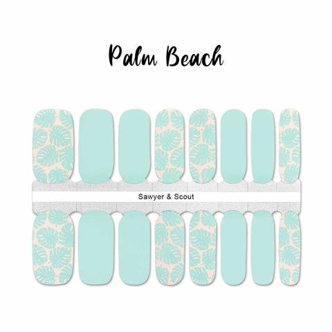 Combination of light aqua palm fronds on a peach background with solid aqua nail accents wrap nail design
