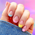 Multi colored pastel nail wrap nail design.  The different color French tips include yellow, salmon, light blue, and pink.