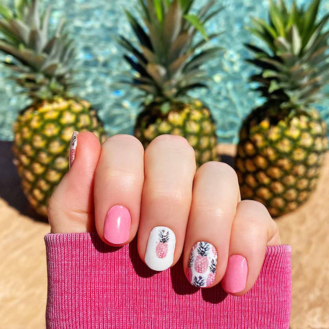 Pink pineapples on white with solid pink accents nail wrap nail design.  