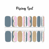 Combination of solid gray, solid gold glitter and mixed curves of gray, gold glitter, pink and white with black spots nail wrap nail design.  
