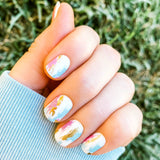 Blue, pink and gold brush strokes on white nail wrap nail design.  