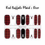 Full red buffalo plaid with red buffalo plaid deer head silhouette on white accents and one white deer head silhouette on black accent nail wrap nail design.  