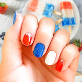 Full red, full white and full blue with sparkles nail wrap nail design with silver glitter on the cuticle end of the red wraps  