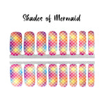 Mermaid scales on top of a color mix of yellow, red, purple and blue nail wrap nail design.  