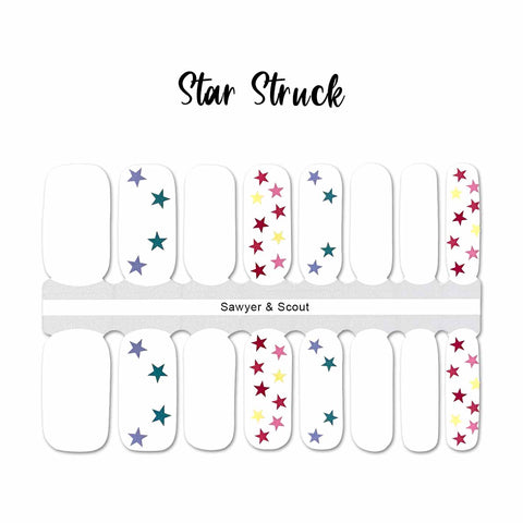 Solid white and multi colored stars on white nail wrap nail design.  