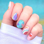 Mix of smiley faces, red hearts, watermelon, curves, and spots with a color palette of blue, purple, pink, red and white nail wrap nail design.  