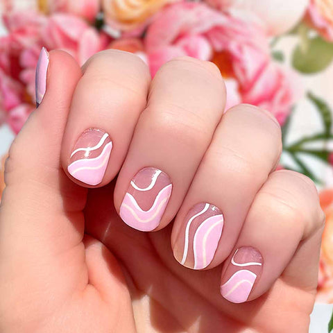 Pink and white curves on clear nail wrap nail design.  