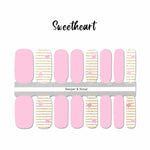 Combination of solid pink nail wraps and gold glitter stripes on white with little pink hearts accents nail wrap nail design.  