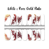 Combination of rose gold foil splotches on white and solid white accents nail wrap nail design.  