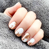 Combination of rose gold foil splotches on white and solid white accents nail wrap nail design.  