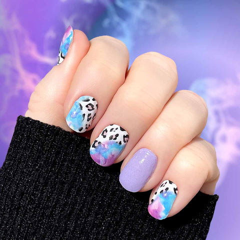 Solid light purple with mixed purple and black cheetah print combined with a blue and pink watercolor color mix nail wrap nail design.  