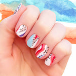 Combination of red, pink and blue cures on white with multi colored dots and cheetah nail wrap nail design.  