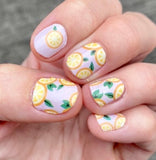 Lemon slices on a light pink background nail wrap nail designs